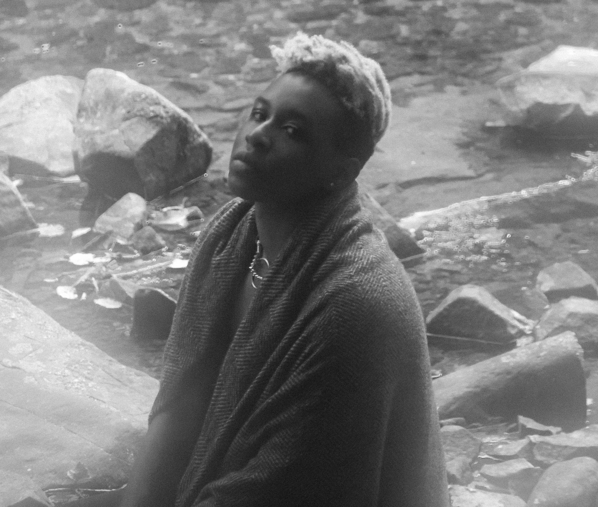 Me in black and white, sitting amongst the water.